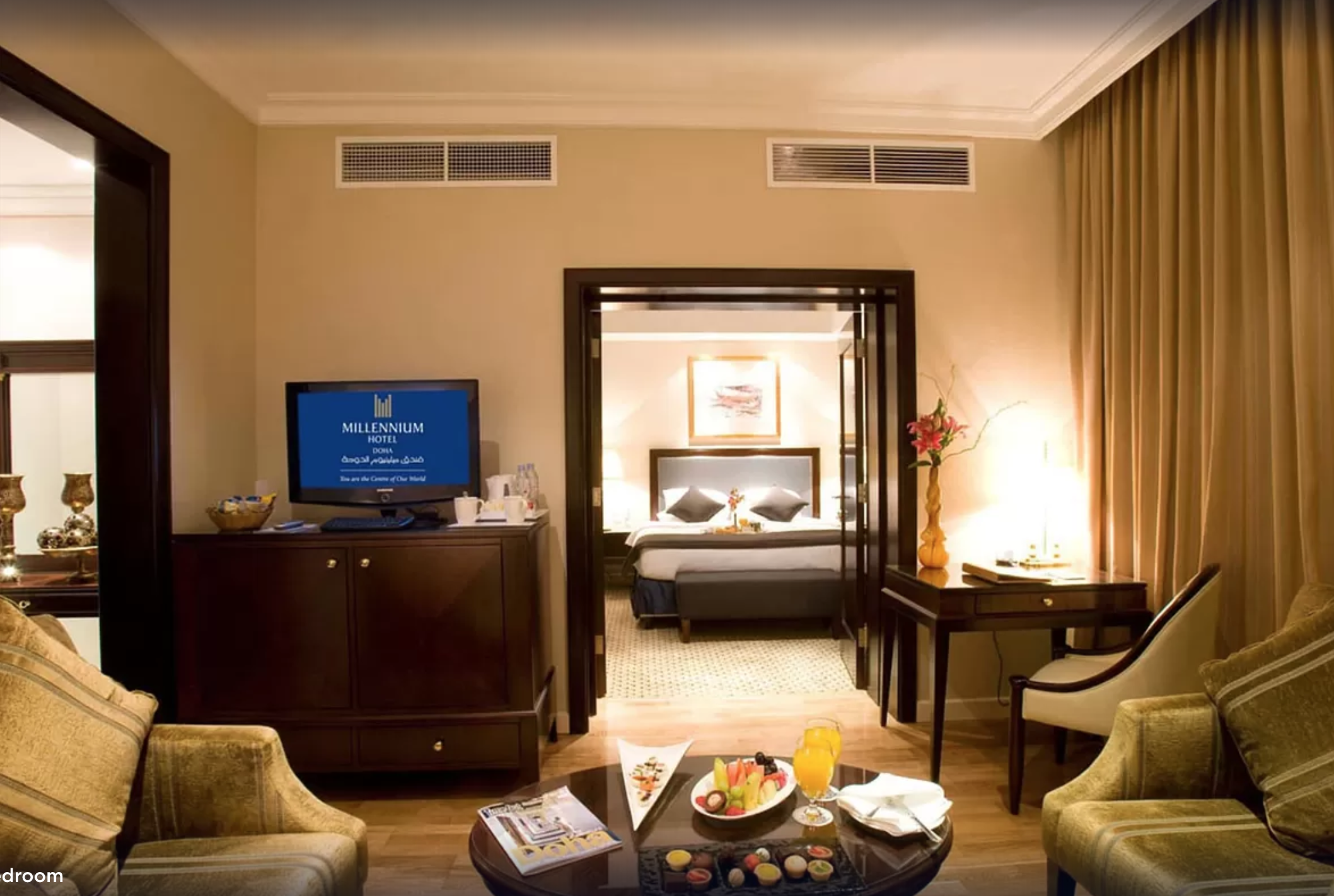 Junior Suite with a large King size bed at Millennium Plaza Doha