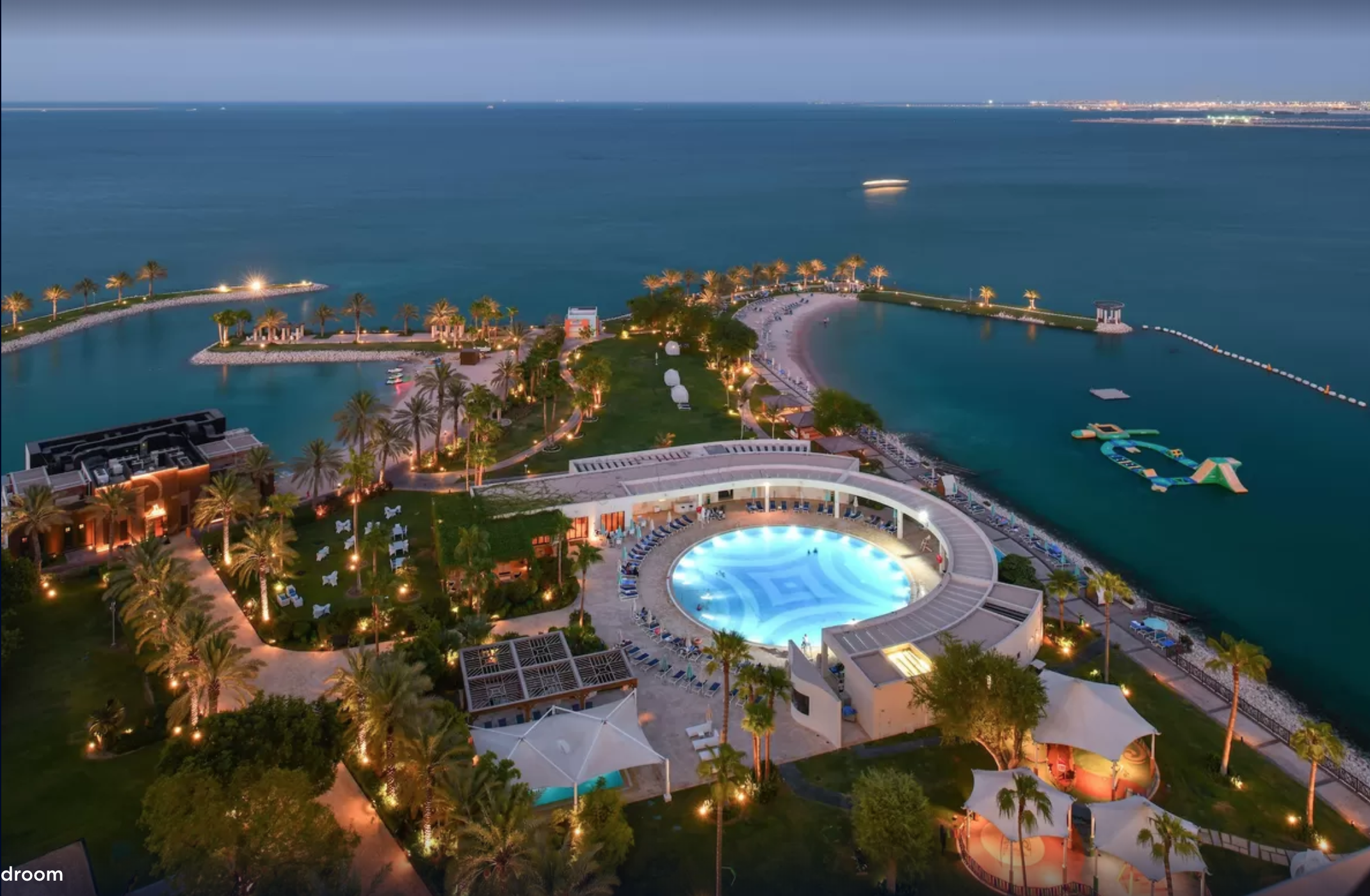view of Arabian sea and swimming pool at Sheraton Grand Doha Resort