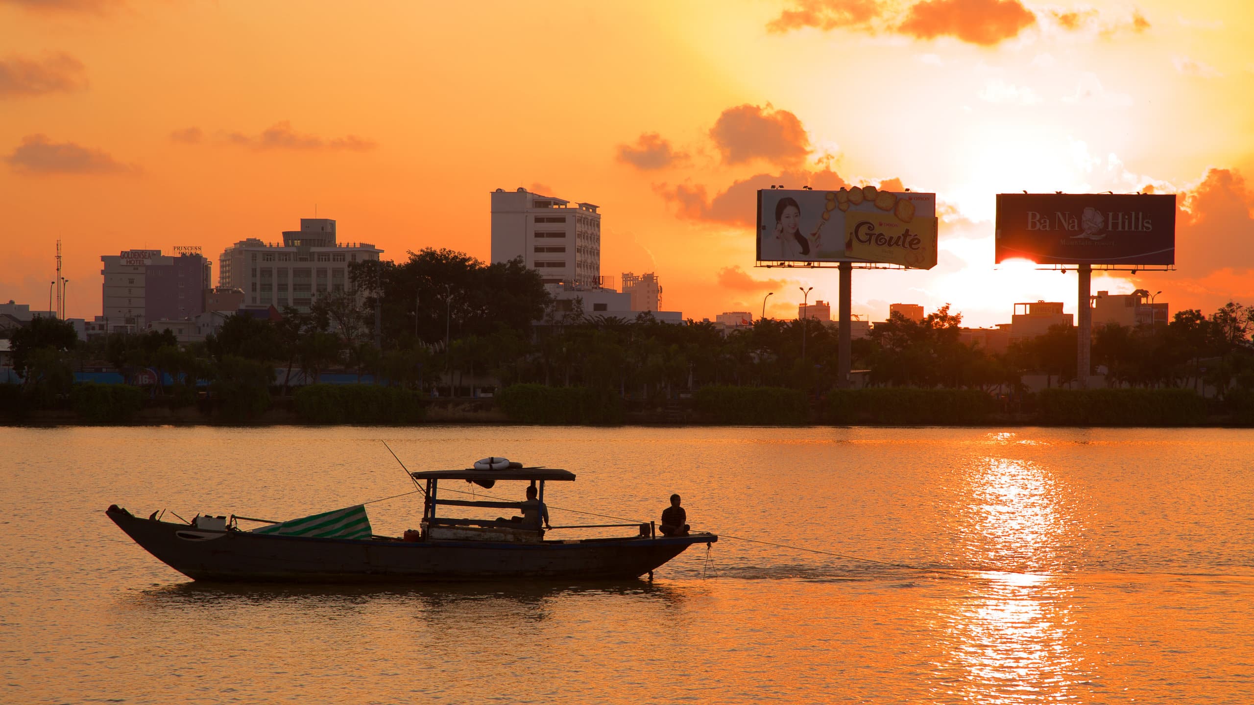 boat on body of water at sunset