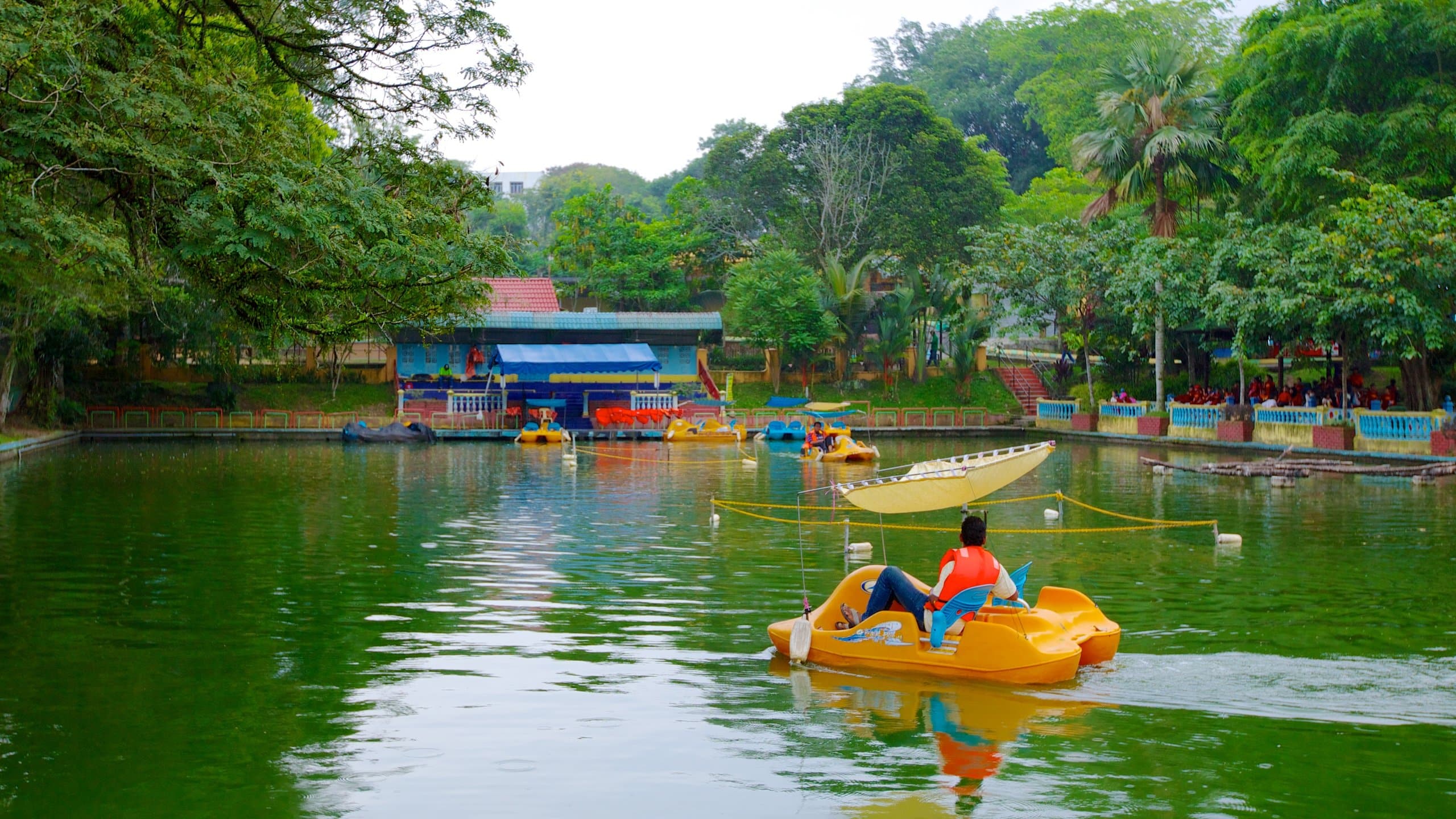 person boating along river