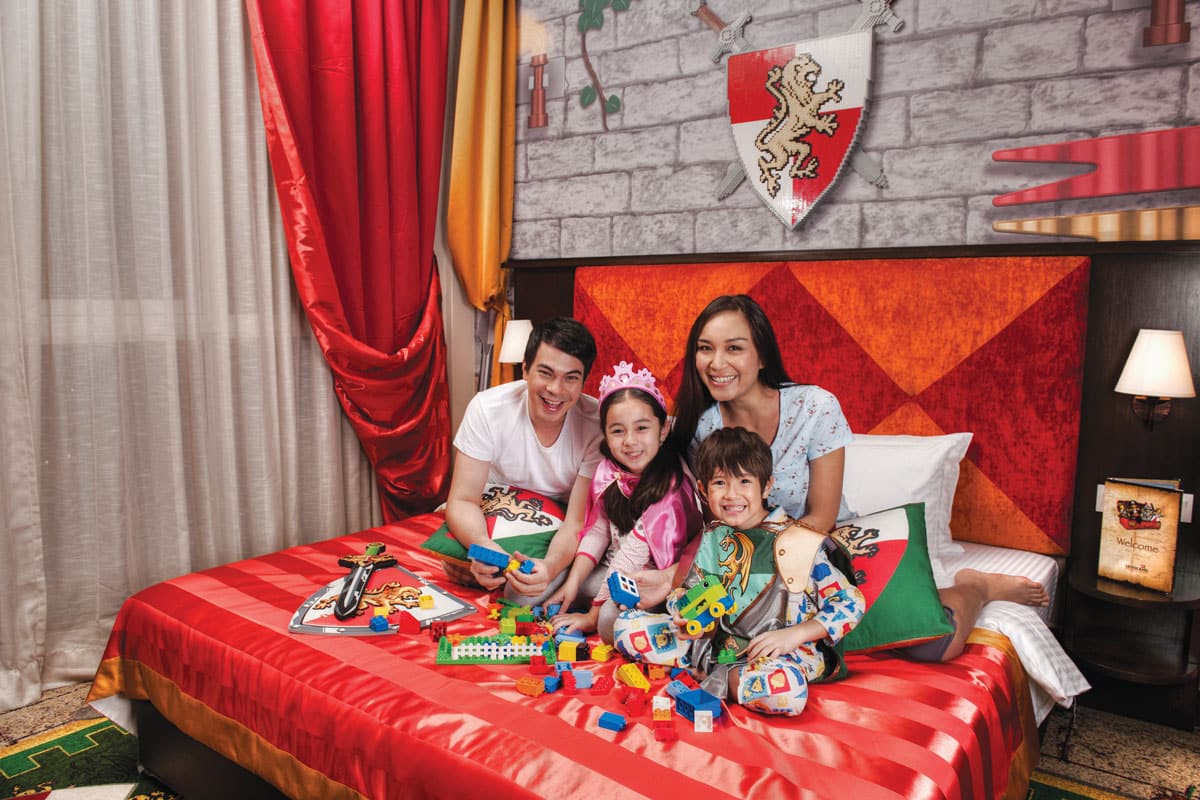 parents children on bed legoland