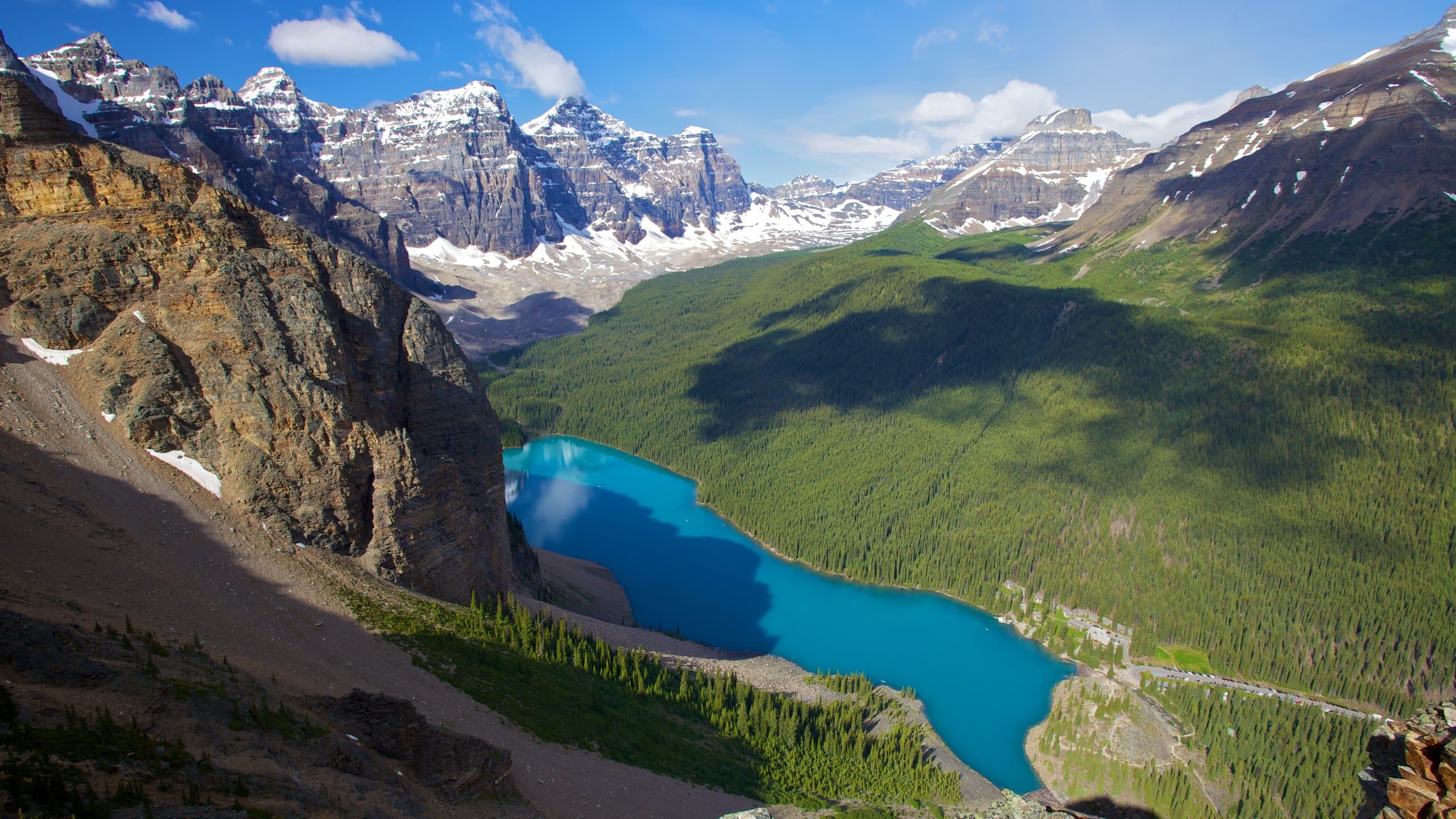 aerial shot of lake surrounded by mountains