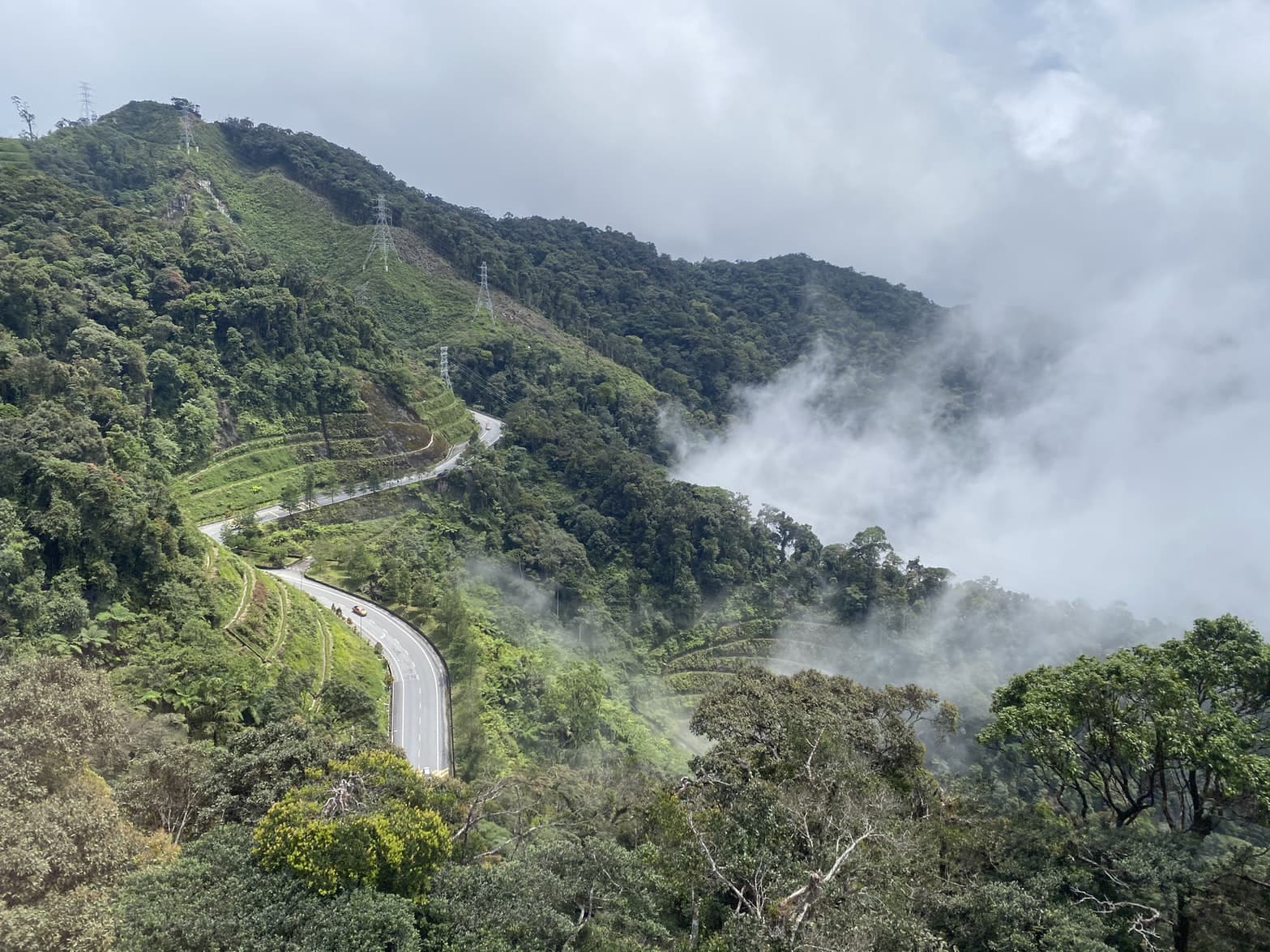 mountain road surrounded by clouds