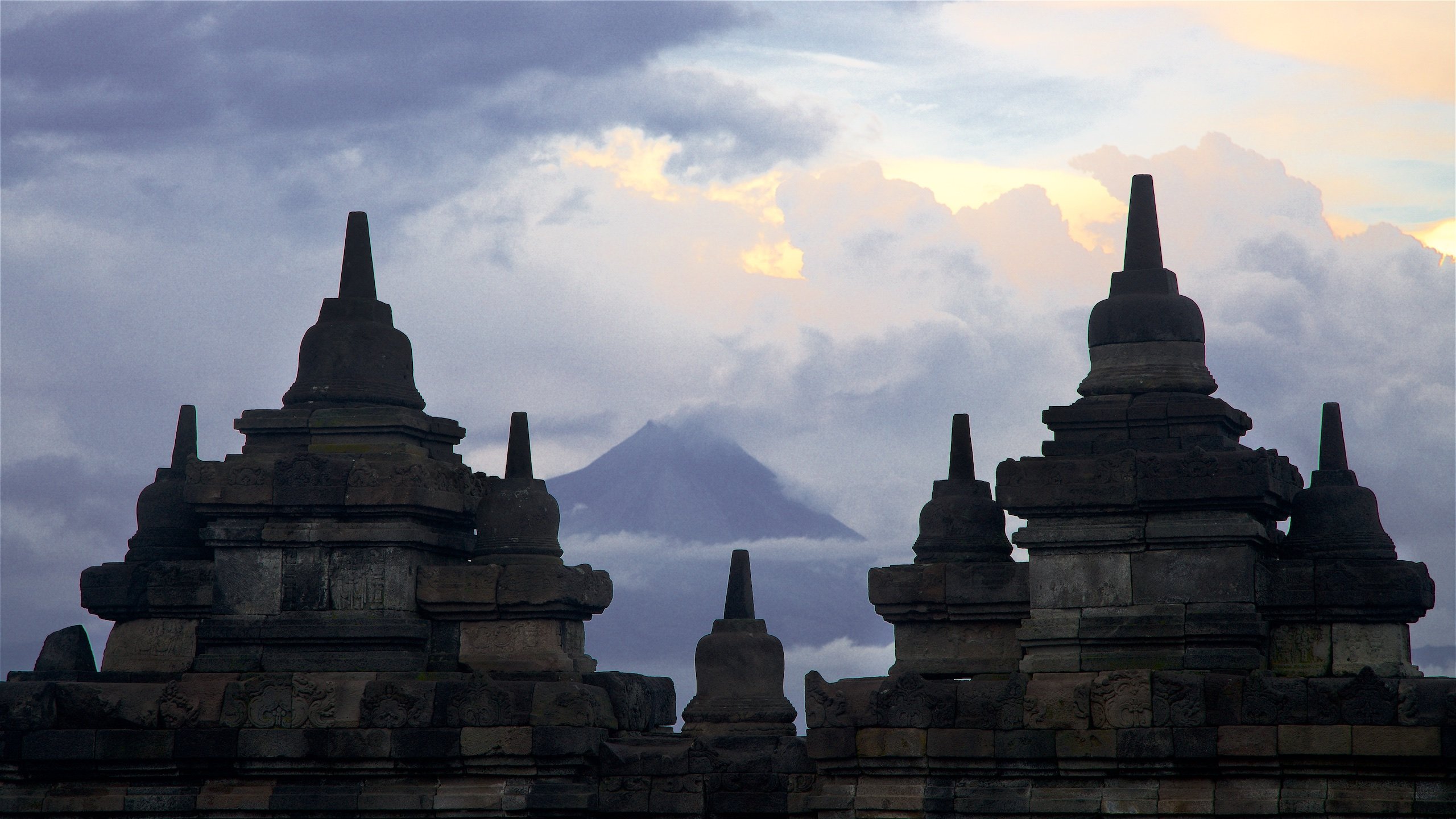 temple silhouette with mountain in background
