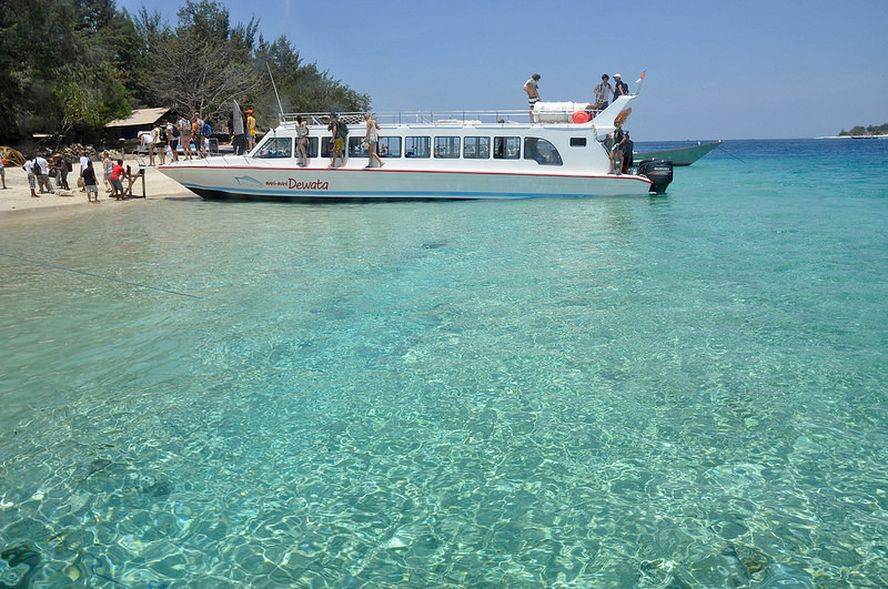 Diving in Indonesia - Tourists arrive at the popular Gili Trawangan, the best place to dive in Lombok